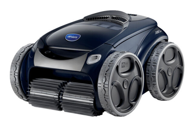 Polaris Alpha iQ plus robotic pool cleaner. The cleaner has a gray front brush and wheels. The body is predominantly navy-blue with black and silver accents. The Polaris logo is on the front/top above the gray front-brush.