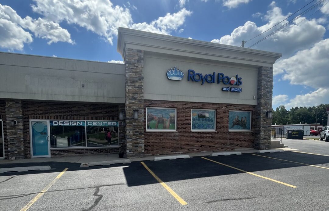 Royal Pools and More retail store on a bright summer day with some clouds in the background.