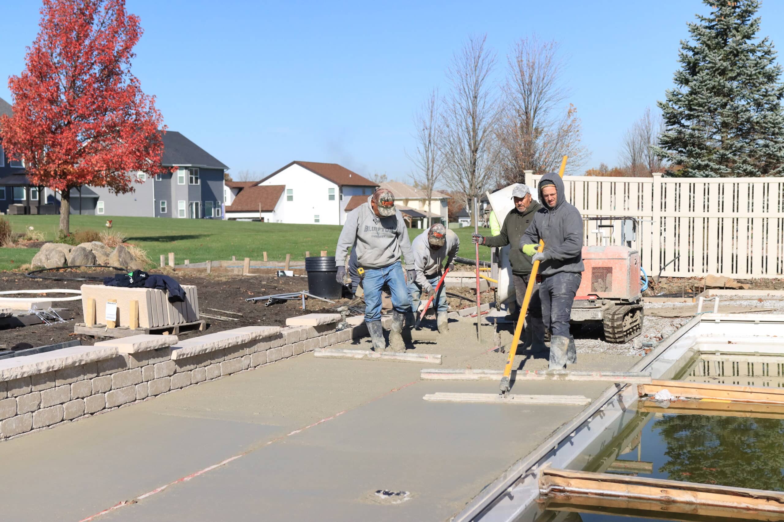 concrete around pool Workings flattening concrete around an inground pool.