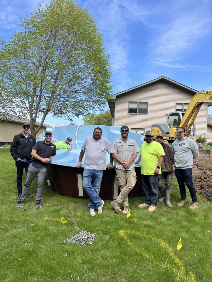 Fiberglass pool and guys standing in front of it