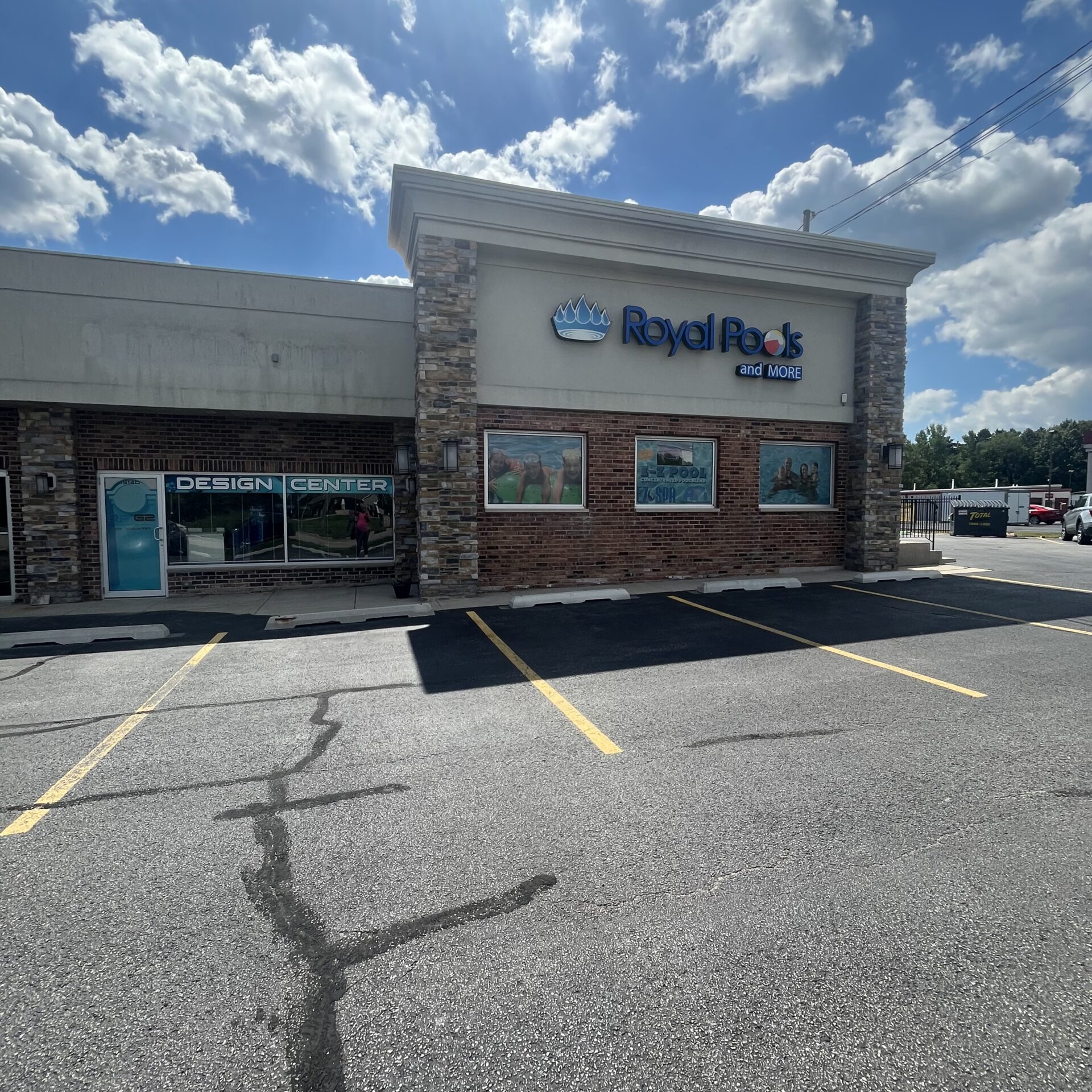Royal Pools and More retail store on a bright summer day with some clouds in the background.