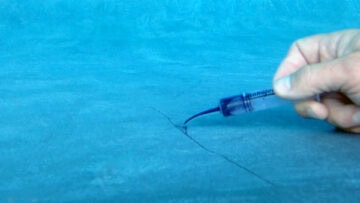picture of fiberglass pool with dye to help show cracks